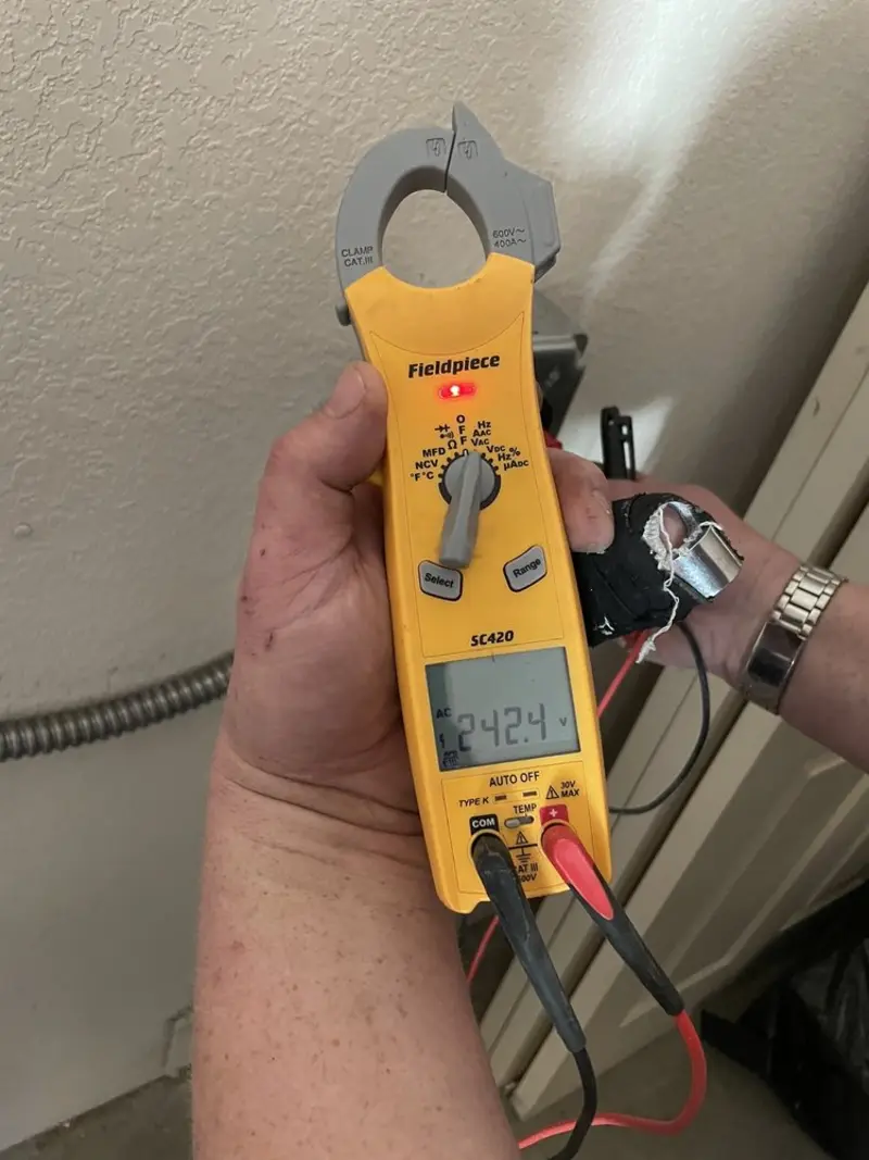 Voltage testing with clamp meter during Recessed Lighting Installation in Laurel